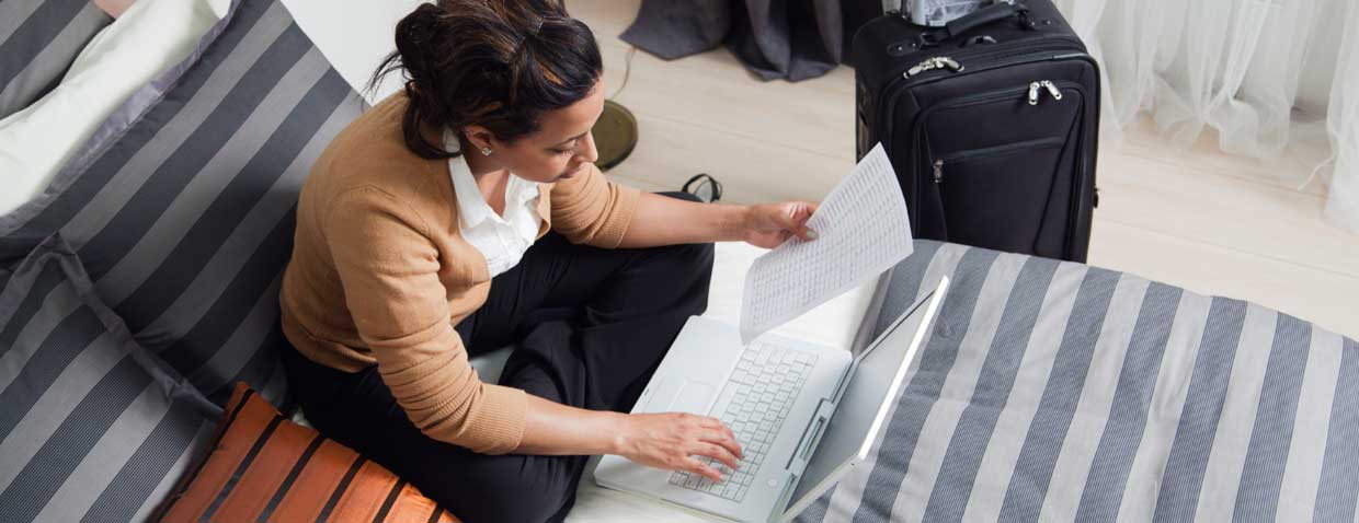 Image depicting hotel traveler using CWave technology in hotel room